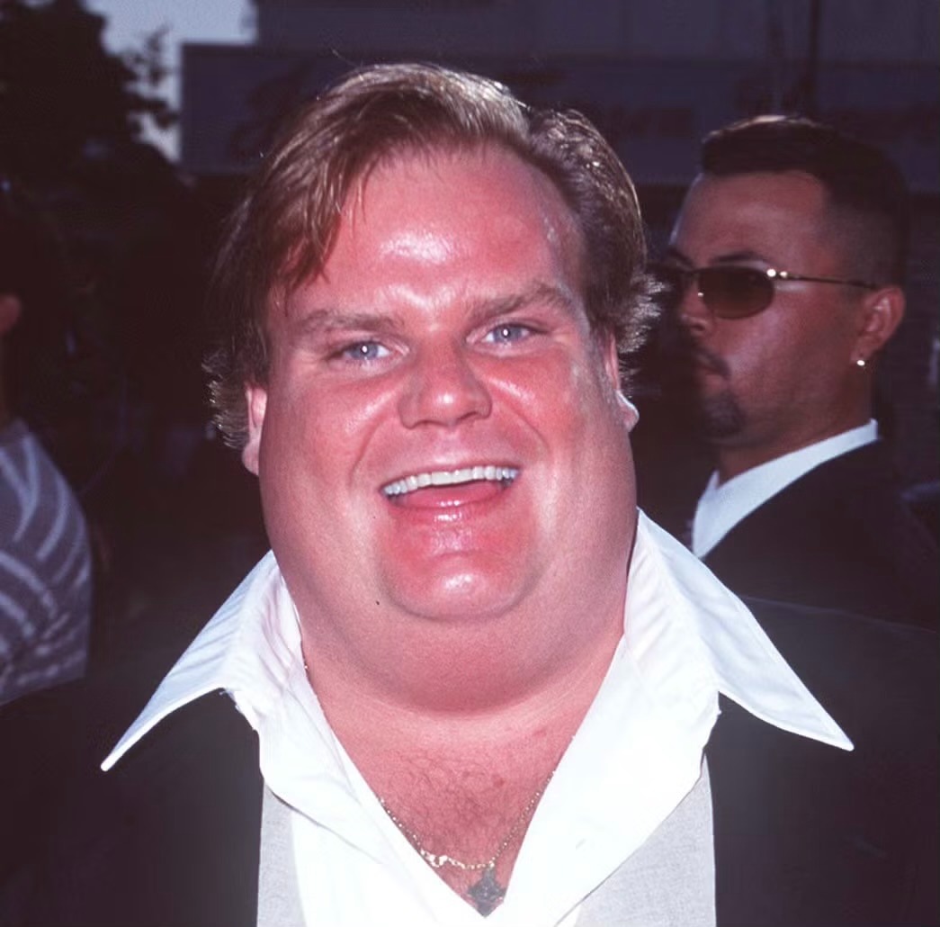 Chris Farley performing on stage